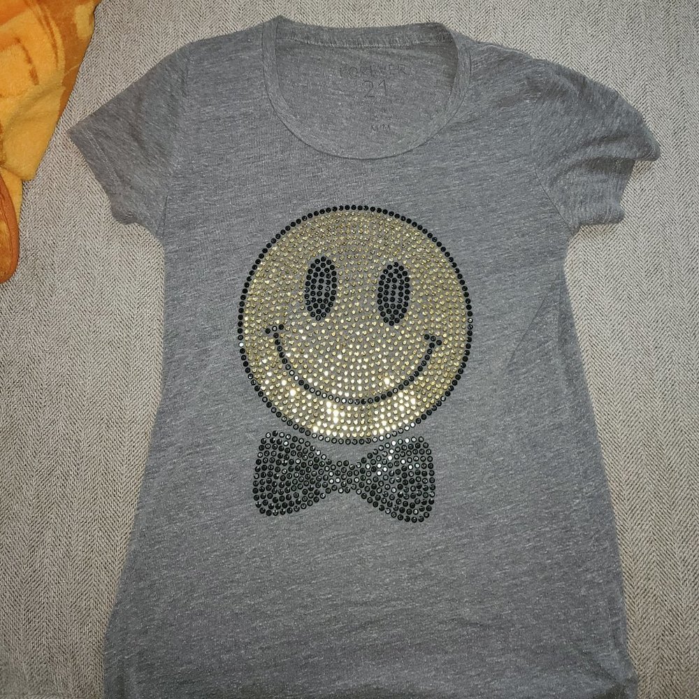 grey t-shirt with a happy face on it